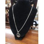 Heavy silver chain with silver rennie mackintosh pendant.