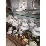 Shelf of tea sets.