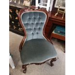 Reproduction button back uphostered chair.