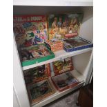 2 Shelfs of vintage puzzles .