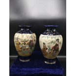 Pair of Chinese satsuma vases signed to the base. 9 inches in height.