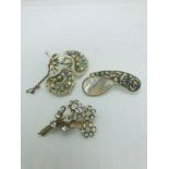 3 vintage rhinestone and mother of pearl brooches.