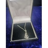 Silver celtic pendant with silver chain.