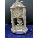 Silver Hall marked birmingham mantle clock makers mappin and Webb with small bird decor.