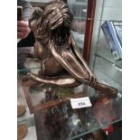 Large bronzed style nude lady figure.