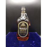 Bottle of 12 year old mackinlay legacy scotch whisky 70% proof 26 2/3 fl ozs 75.7 CL. Full and