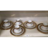 Limoge porcelain Tea service in the gilt and black rimmed design.