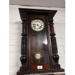 Antique wall clock with pendulum.