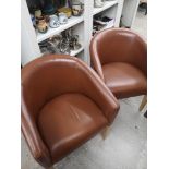 Pair of modern contemporary captain chairs.