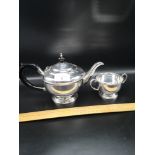 Silver Hall marked birmingham tea pot together with silver hallmarked Birmingham sugar dish.