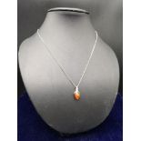 Silver chain with Amber effect design.