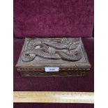 Oriental carved topped jewellery box depicting dragon.
