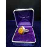 Silver ring marked 925 set in Amber stone.