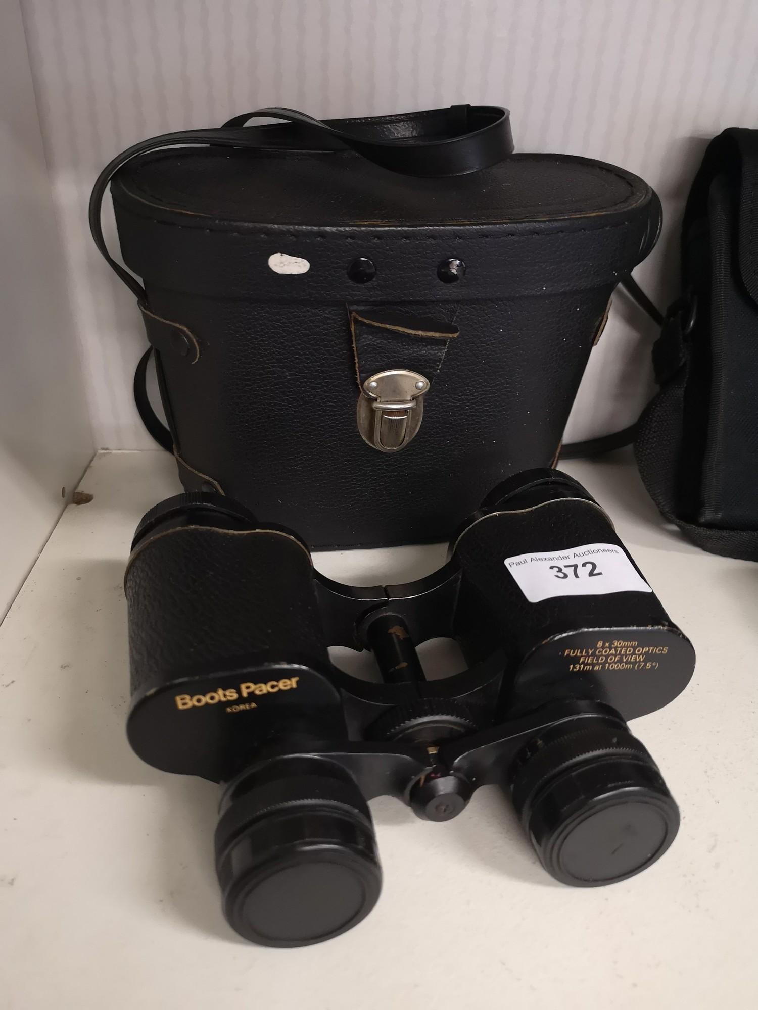 Set of boots pacer 8 x30 binocalurs with case.