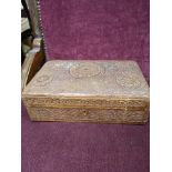 Antique carved box needs attention.