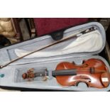 Stinger violin with bow in fitted casing.