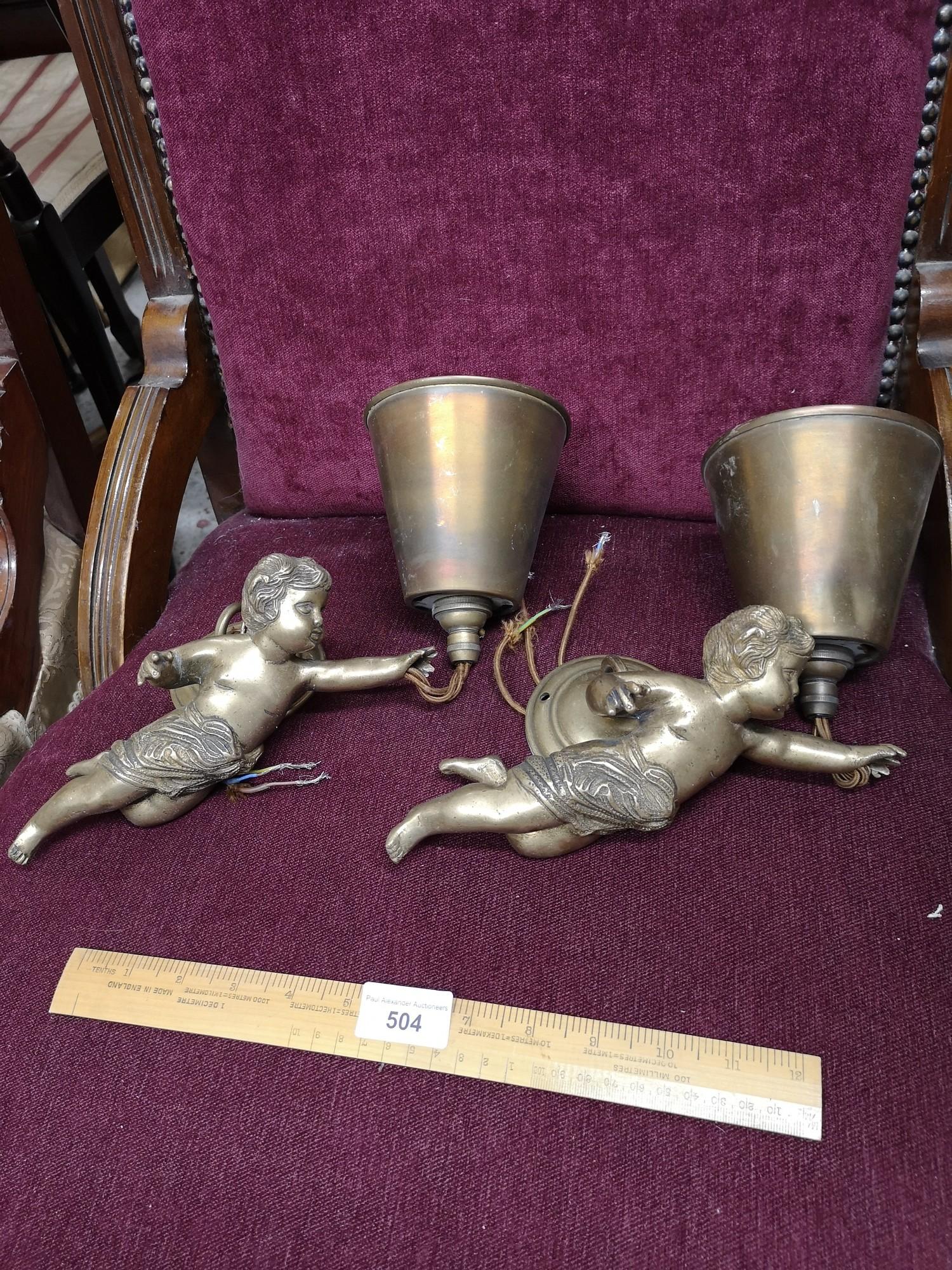 Pair of heavy quality brass cherubs wall light s with electrical fitting s.