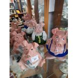 Collection of 4 wafe natwest pig figures/ banks.