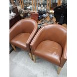 Pair of modern contemporary leather captain style arm chairs.
