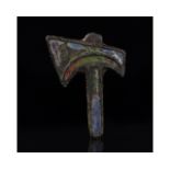 ROMAN BRONZE ENAMELED AXE-SHAPED BROOCH