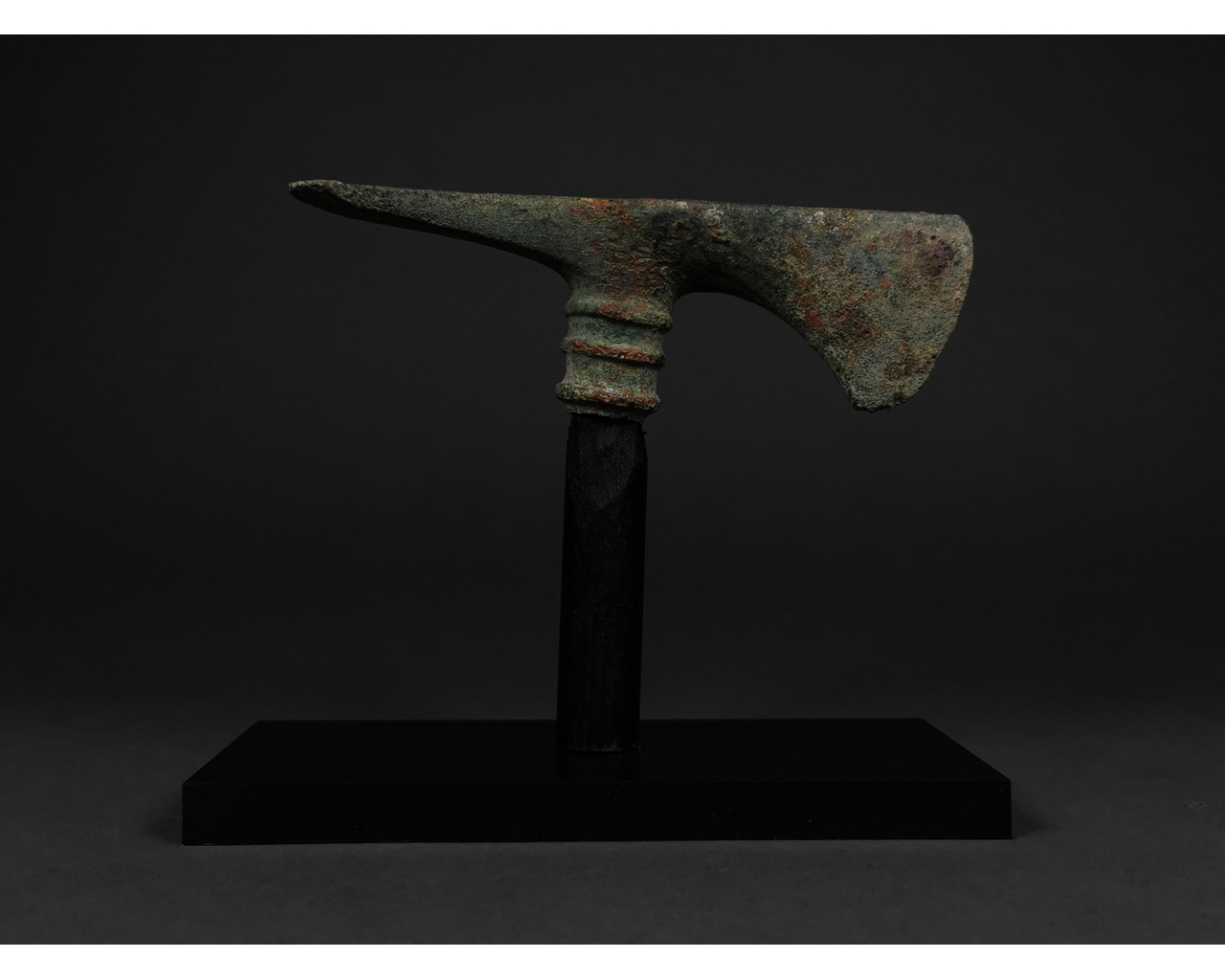 HEAVY BRONZE AGE BATTLE AXE ON STAND