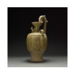 A GREEN-GLAZED POTTERY EWER, CHINA