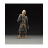 CHINESE MING DYNASTY GLAZED ATTENDANT FIGURE