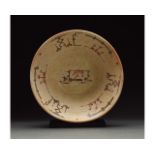 MEDIEVAL ISLAMIC TERRACOTTA PLATE WITH GEOMETRIC PATTERNS