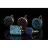 COLLECTION OF FIVE TRIBAL INTAGLIO RINGS