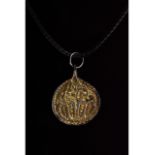 VIKING SILVER GILT ODIN GRIPPING RAVENS AMULET