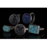 COLLECTION OF FIVE INTAGLIO TRIBAL RINGS