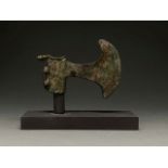 BRONZE AGE AXE WITH ANIMAL PATTERN ON STAND