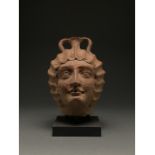 ROMAN FIGURAL HEAD JAR OF A WOMAN