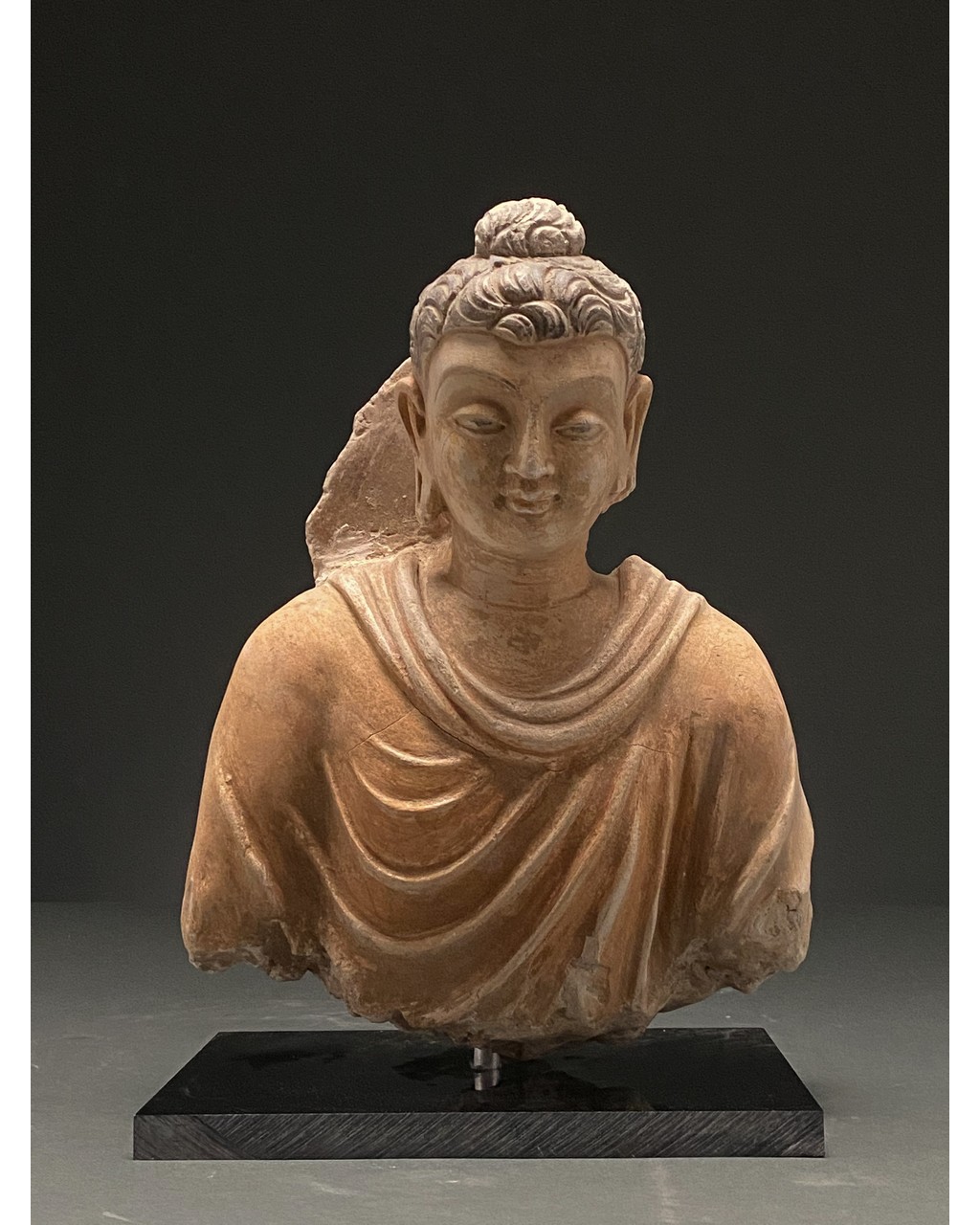 GANDHARA PAINTED STUCCO FIGURE OF BUDDHA