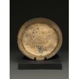 ISLAMIC, SELJUK BRONZE PLATE WITH GEOMETRIC DESIGNS