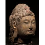 CHINA, TANG DYNASTY GILDED STONE HEAD OF BUDDHA