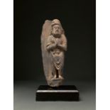 GANDHARA SCHIST STONE FIGURE OF A BUDDHIST WORSHIPER