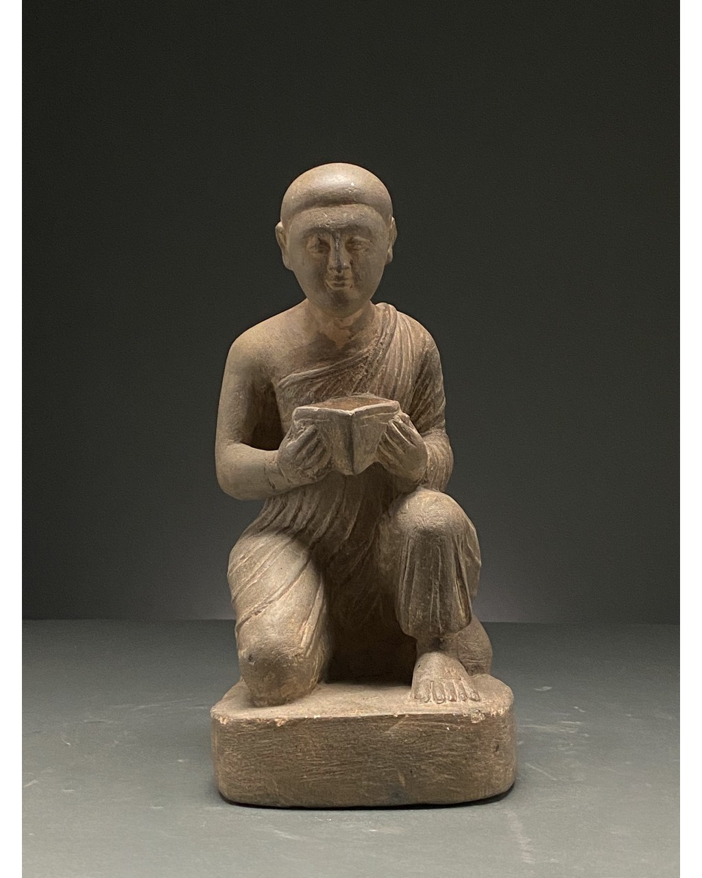 GANDHARA SCHIST STONE FIGURE OF KNEELING WORSHIPER