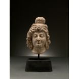 GRAECO-BACTRIAN MARBLE HEAD OF A FEMALE