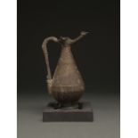 ISLAMIC, SELJUK BRONZE JUG WITH GEOMETRIC DESIGNS