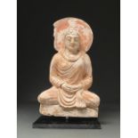 GANDHARA PAINTED STUCCO FIGURE OF BUDDHA