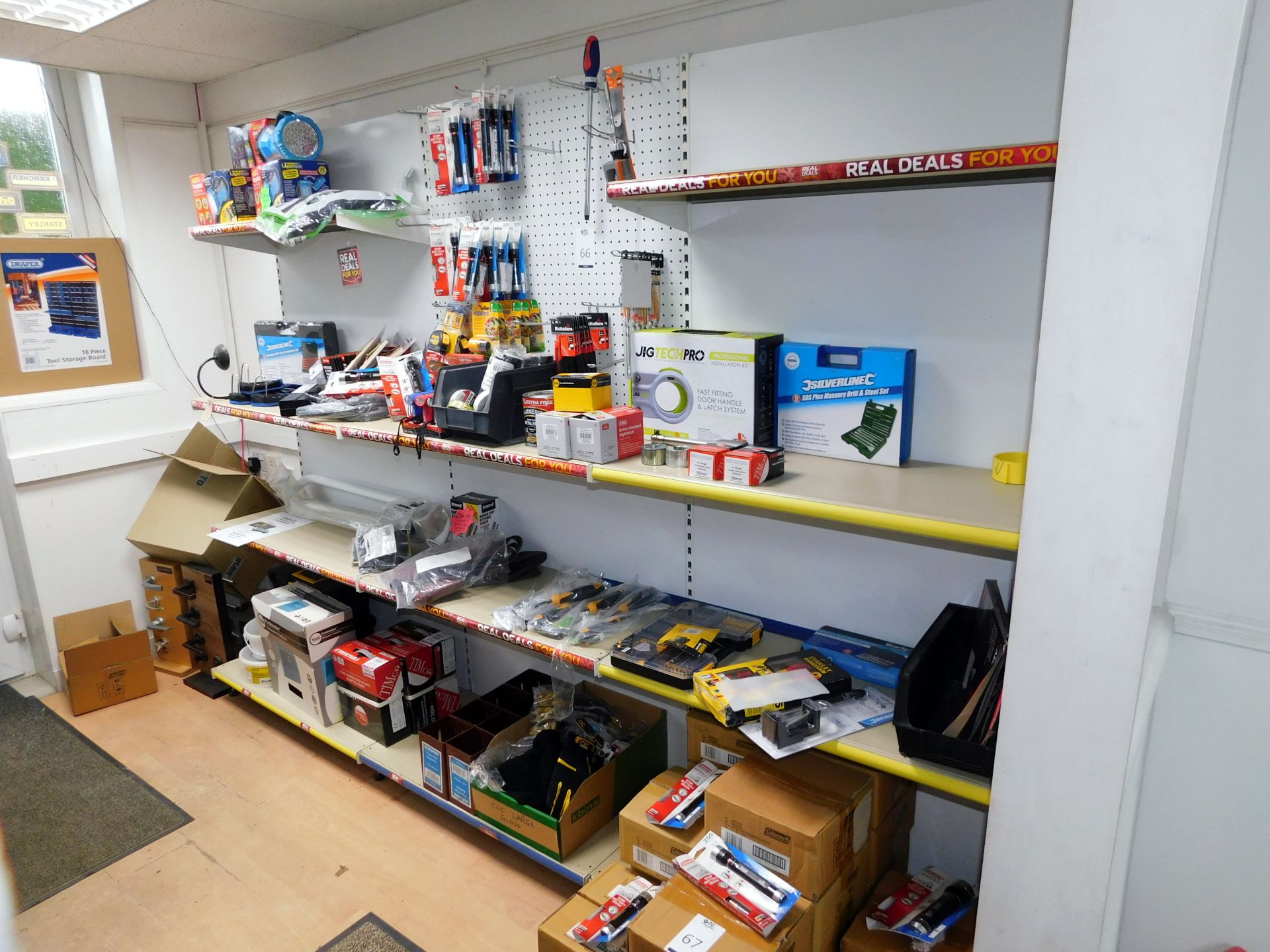 Contents of Wall to Include Torches, Screwdriver Sets, Mousetraps, Tools, Work Gloves (Excludes