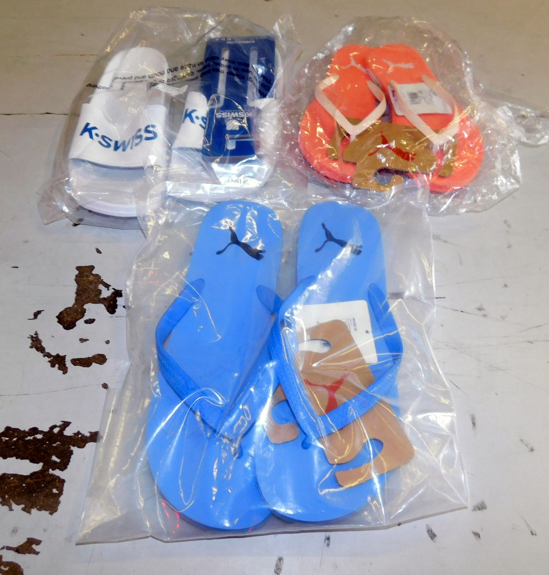 312 Pairs Flip Flops/Sliders (99 K Swiss and 213 Puma) (Located Stockport – See General Notes for