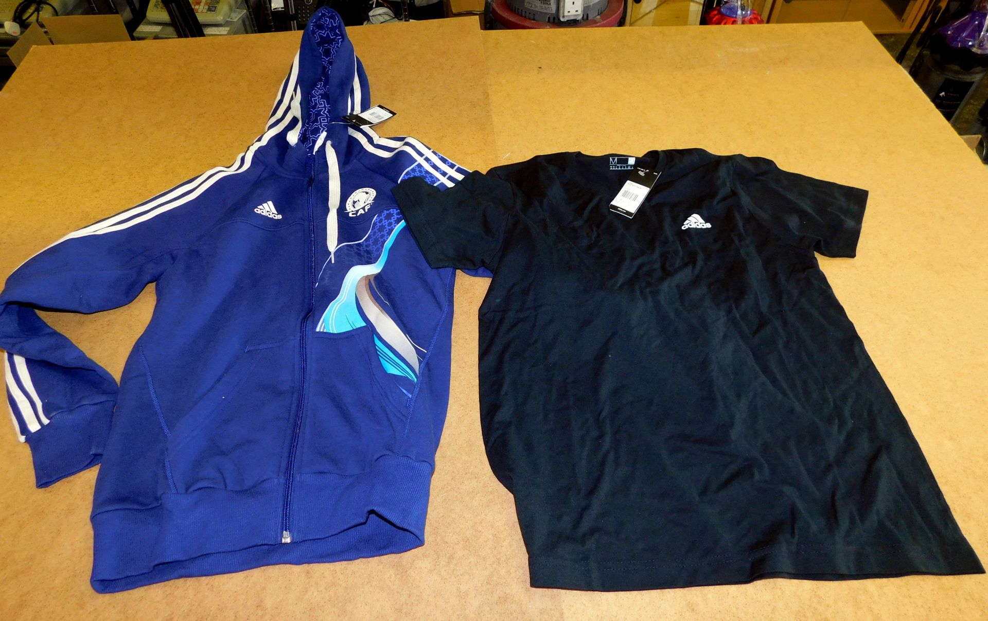 170 Adidas Garments (118 Team Staff Tee, 10 Volunteer CAF Hoodie, 42 Portugal Tee Shirt) (Located