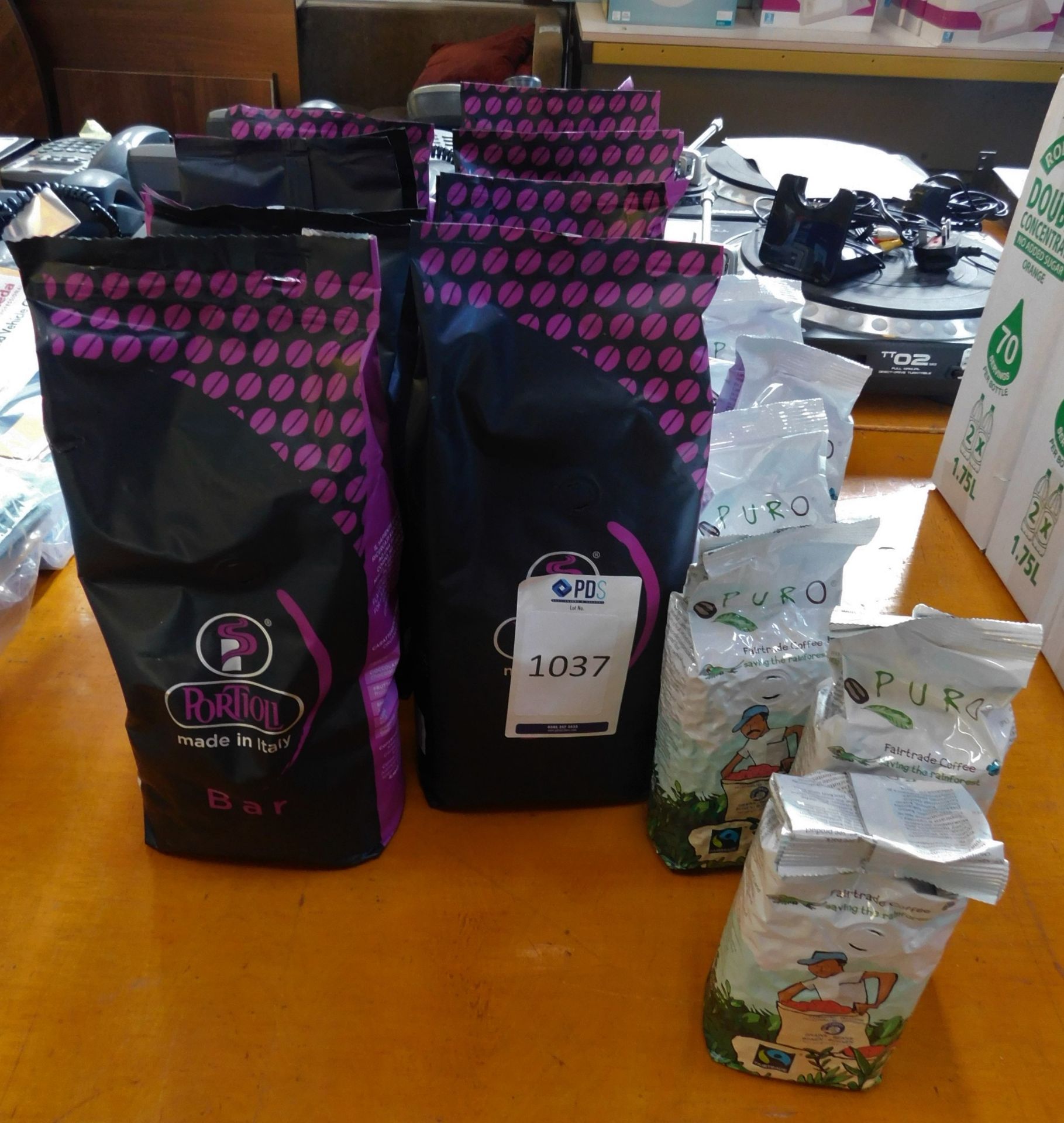 8 Packets of Portioli Coffee Beans (June 2021) and 8 Puro Fair Trade Coffee (No VAT on Hammer) (