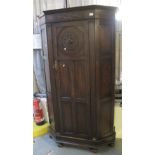 Early 20th Century carved oak single door hall cupboard on pad feet. (B.P. 24% incl. VAT)