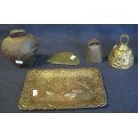 A rectangular cast metal tray decorated with foliage and ducks, possibly oriental, two cow bells,
