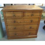 19th Century pitch pine straight front chest of two short and two long drawers on a projecting base.