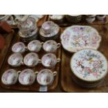 Two trays of Mintons bone china teaware on a white ground with painted oriental decoration