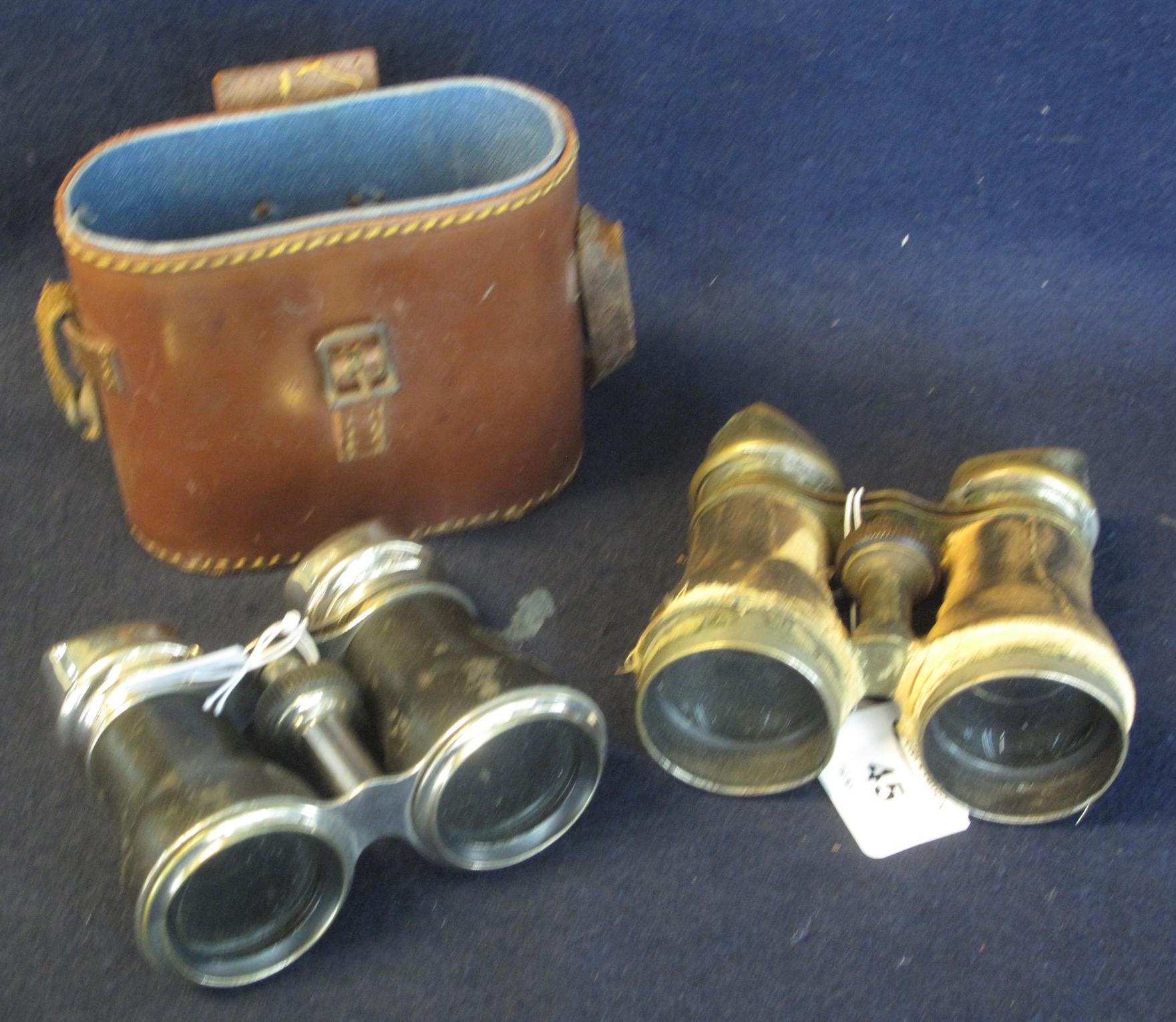 Two pairs of opera/field glasses, one in leather case. (2) (B.P. 24% incl. VAT)